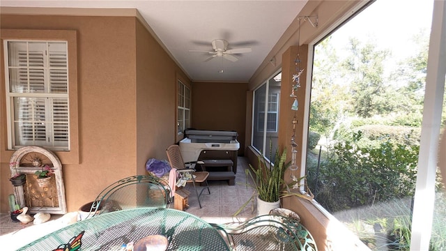 sunroom / solarium with ceiling fan