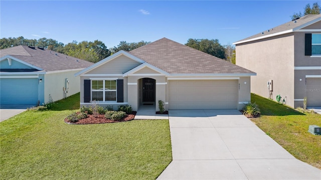 view of front of home with a garage and a front yard