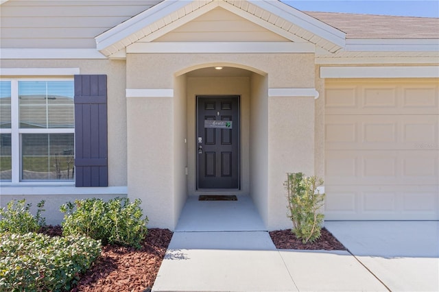 doorway to property featuring a garage