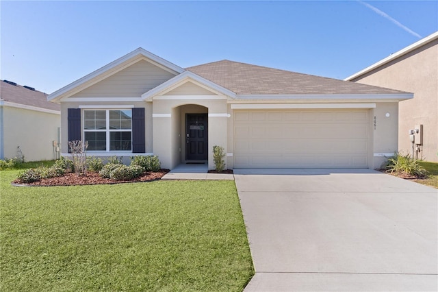 single story home featuring a garage and a front yard