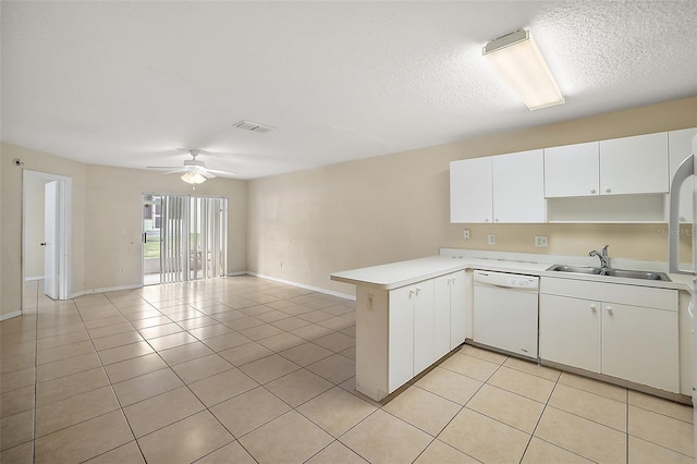 kitchen with kitchen peninsula, ceiling fan, white dishwasher, white cabinets, and sink