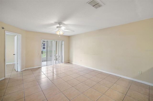 unfurnished room featuring ceiling fan and light tile patterned floors