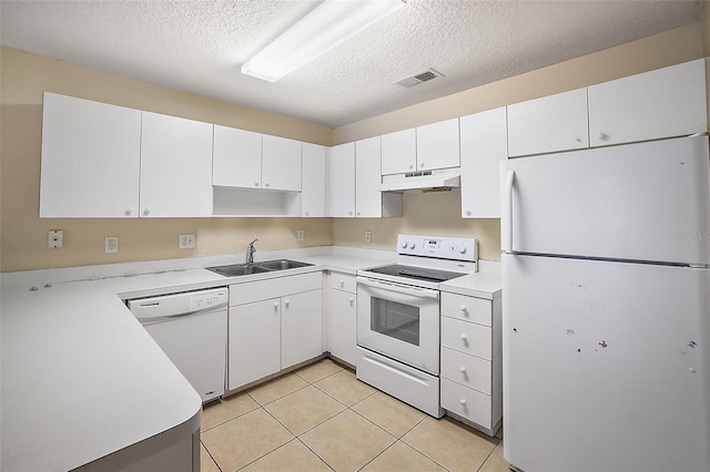 kitchen with white cabinets, sink, white appliances, and a textured ceiling