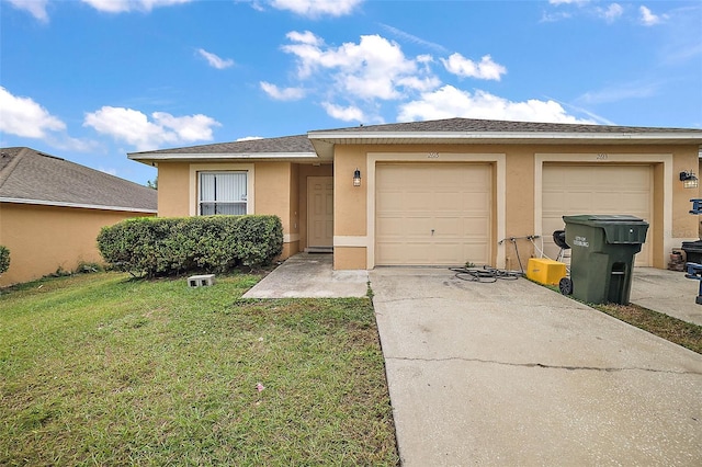 view of front of property with a front lawn and a garage