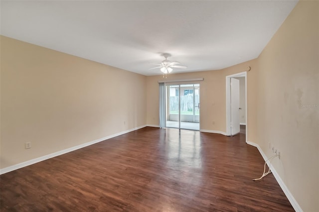 unfurnished room featuring dark wood-type flooring and ceiling fan