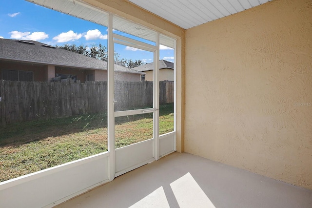 unfurnished sunroom featuring a healthy amount of sunlight