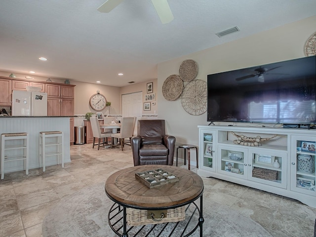 living room with ceiling fan