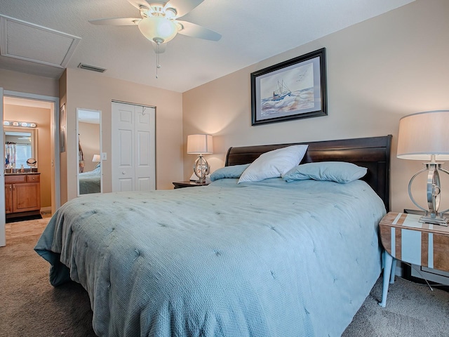 bedroom with a closet, light colored carpet, and ceiling fan