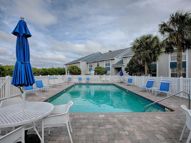 view of swimming pool featuring a patio area