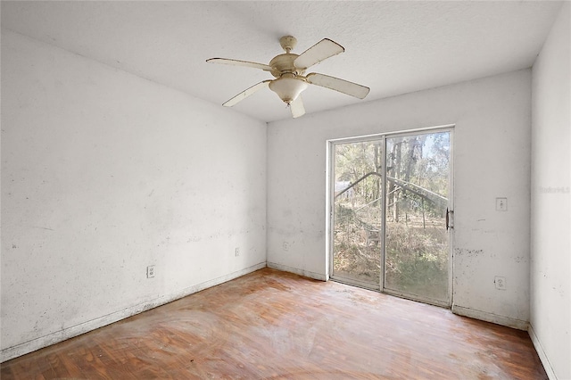 unfurnished room with ceiling fan