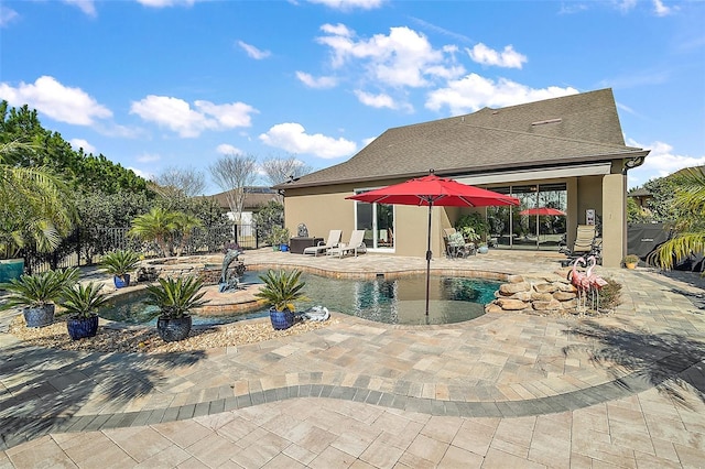 view of pool featuring a patio area and a hot tub