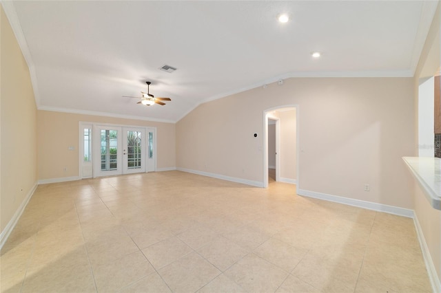 empty room with ornamental molding, lofted ceiling, ceiling fan, and french doors