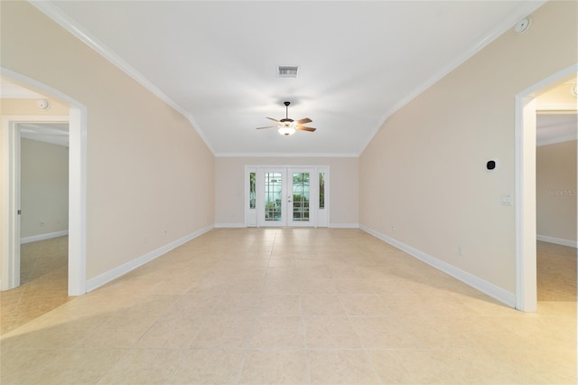 tiled spare room featuring french doors, ceiling fan, ornamental molding, and vaulted ceiling