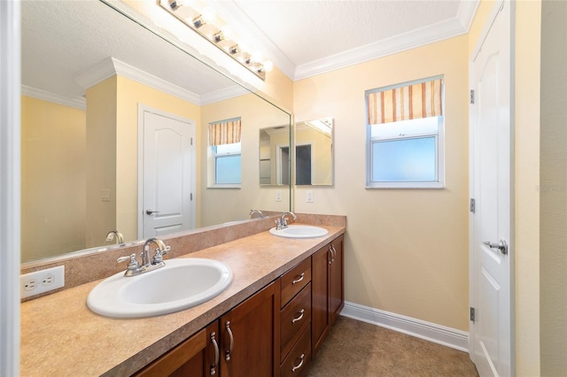 bathroom with ornamental molding, vanity, and a textured ceiling