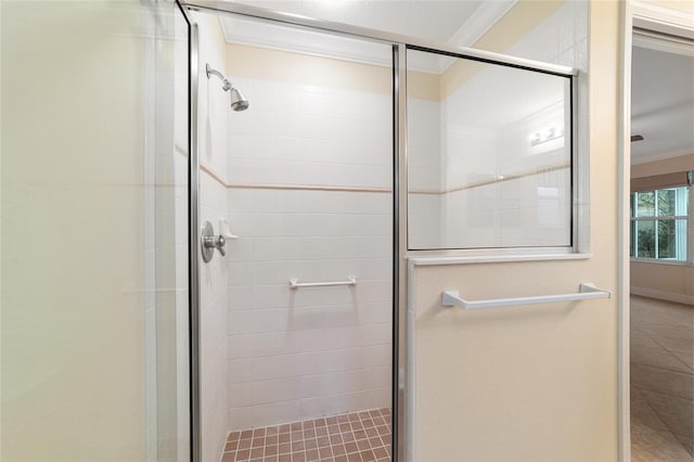 bathroom featuring walk in shower and ornamental molding