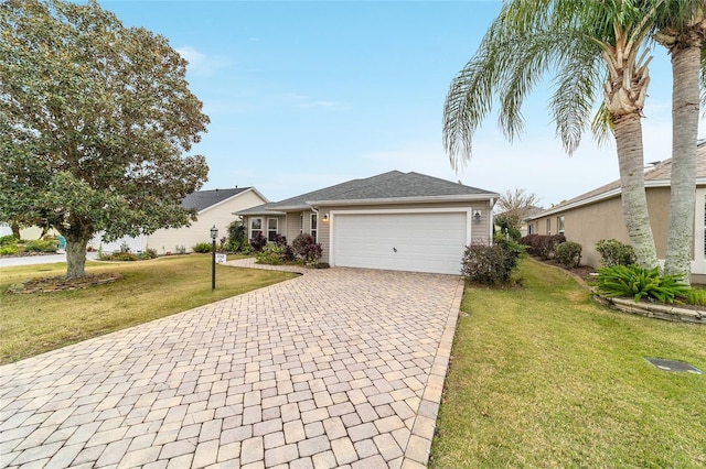 ranch-style house with a garage and a front yard