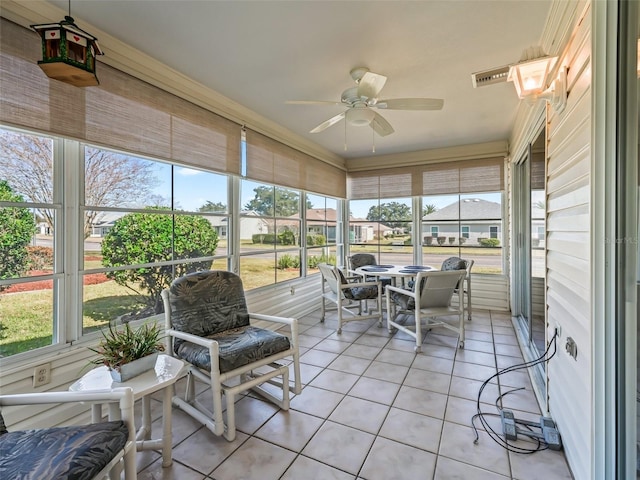 sunroom / solarium with ceiling fan