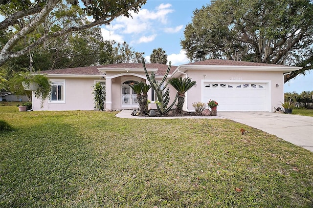 view of front of house featuring a front yard and a garage