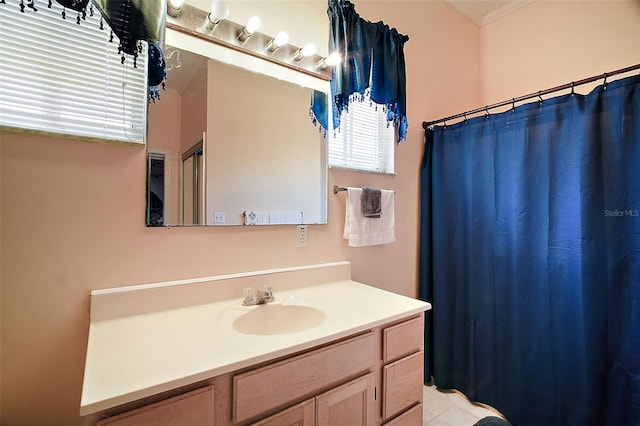 bathroom with vanity, a shower with shower curtain, and tile patterned flooring