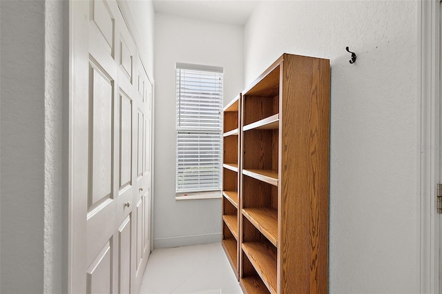 walk in closet featuring light tile patterned floors