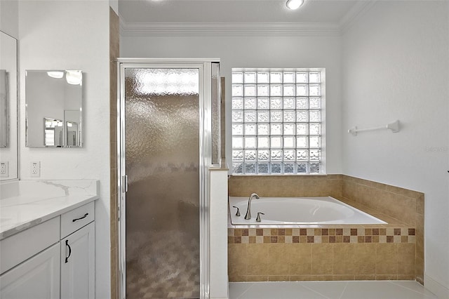 bathroom featuring tile patterned floors, crown molding, separate shower and tub, and vanity