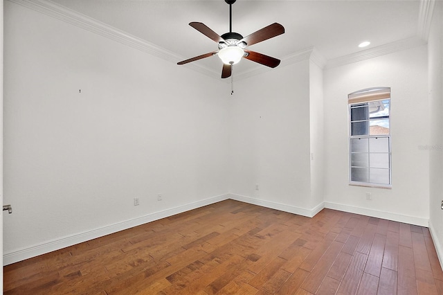 spare room with crown molding, hardwood / wood-style floors, and ceiling fan