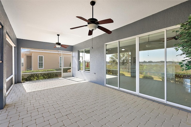 view of patio featuring ceiling fan