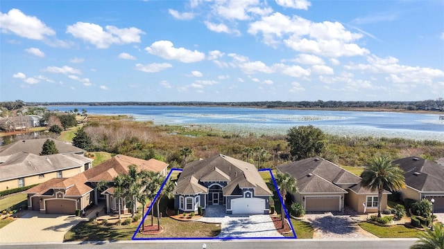 drone / aerial view featuring a water view