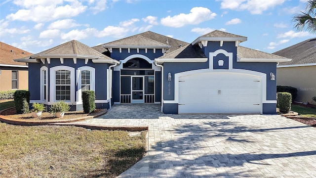 view of front of home with a garage