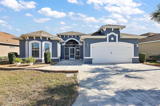 view of front of property featuring a garage