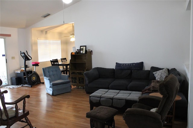 living room with vaulted ceiling, ceiling fan, and light hardwood / wood-style floors