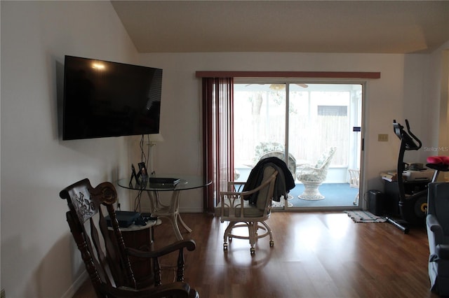 sitting room featuring vaulted ceiling and hardwood / wood-style flooring