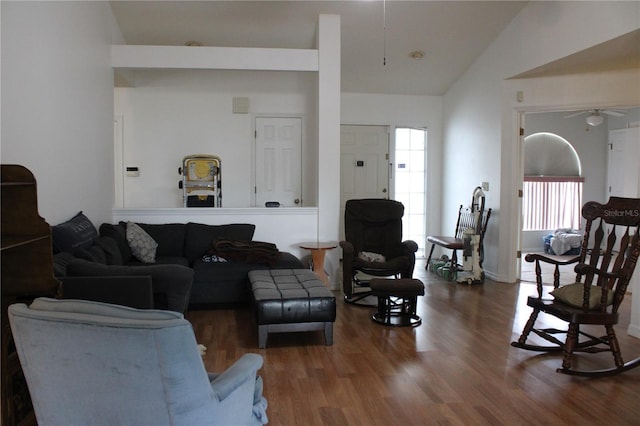 living room featuring hardwood / wood-style flooring, lofted ceiling, and ceiling fan