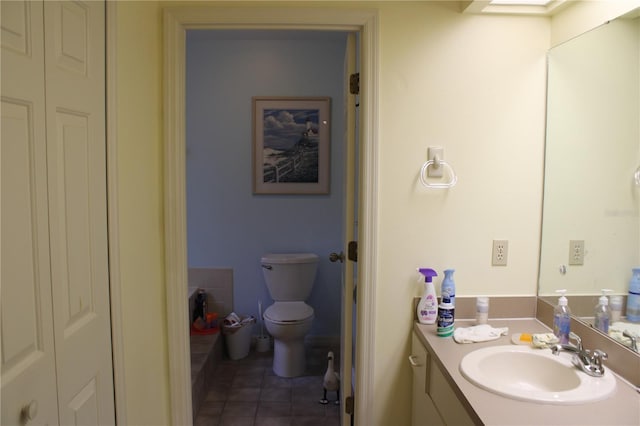 bathroom with toilet and vanity