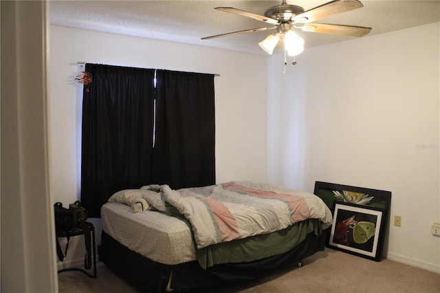 bedroom featuring light carpet and ceiling fan