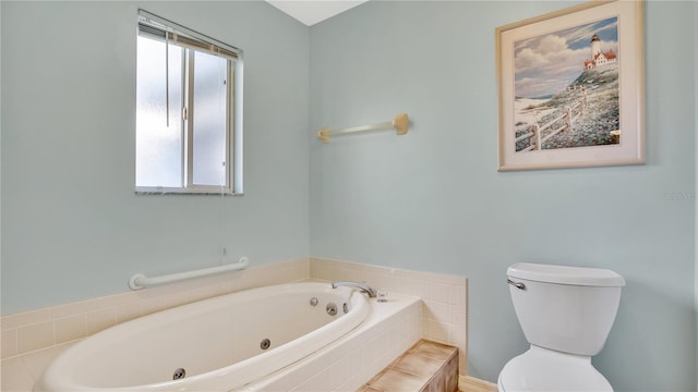 bathroom featuring a relaxing tiled tub, a wealth of natural light, and toilet