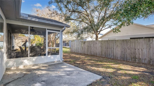 view of yard with a sunroom and a patio area