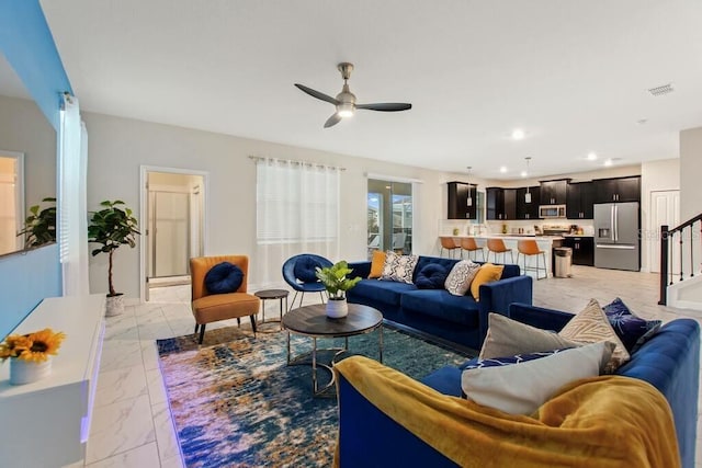 living room with ceiling fan