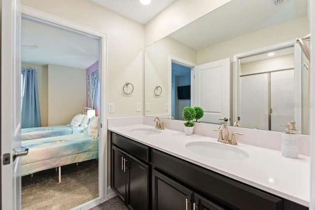 bathroom with an enclosed shower and vanity