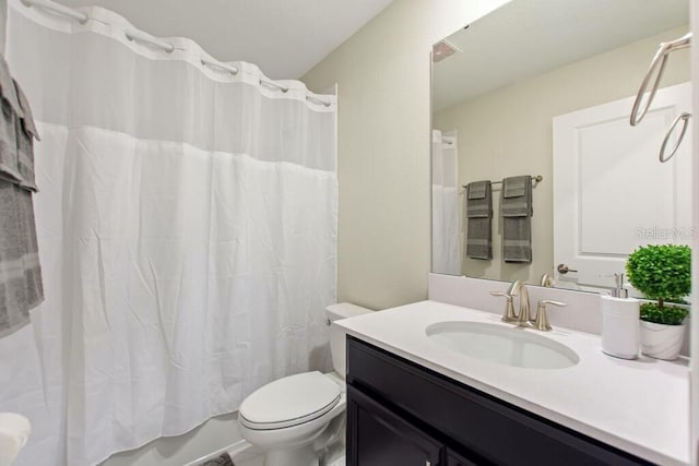 full bathroom with toilet, vanity, and shower / bath combo with shower curtain