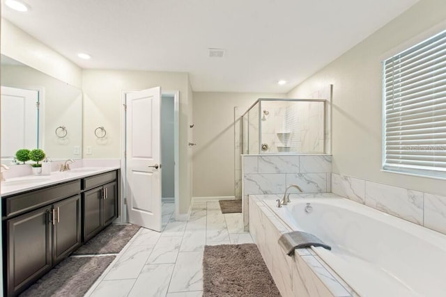 bathroom with vanity and plus walk in shower