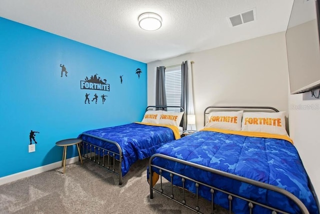 carpeted bedroom featuring a textured ceiling