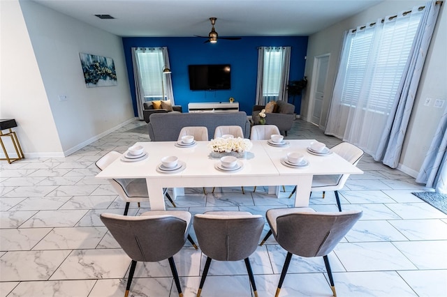 1257 Challenge Dr, Davenport, FL 33896 - dining area with light marble finish floors, healthy amount of natural light, and ceiling fan