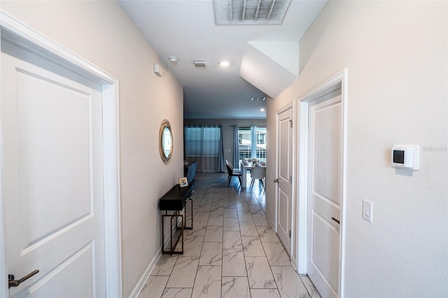 1257 Challenge Dr, Davenport, FL 33896 - hallway featuring light marble finish floors and recessed lighting