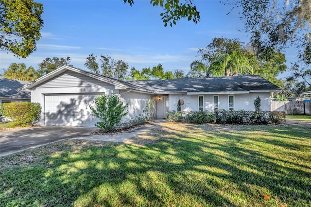 ranch-style home featuring a garage and a front lawn