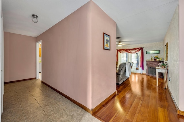 hall with hardwood / wood-style floors