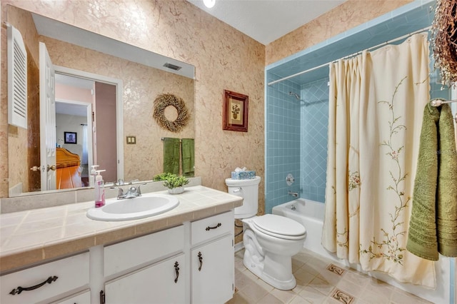 full bathroom with vanity, shower / bathtub combination with curtain, tile patterned floors, and toilet