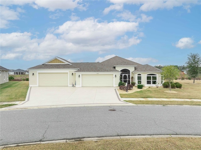 view of front facade with a garage and a front yard