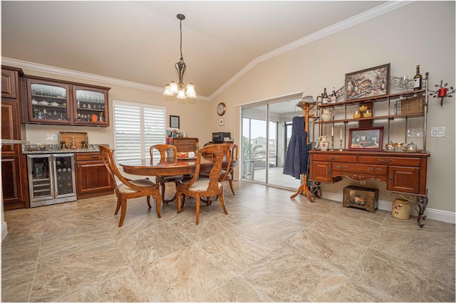 dining area with lofted ceiling, wine cooler, bar area, a chandelier, and crown molding