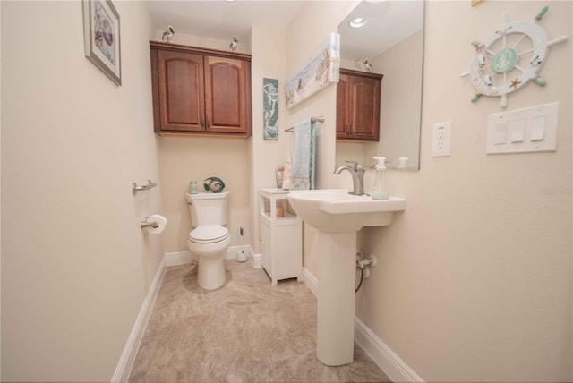 bathroom with toilet and sink